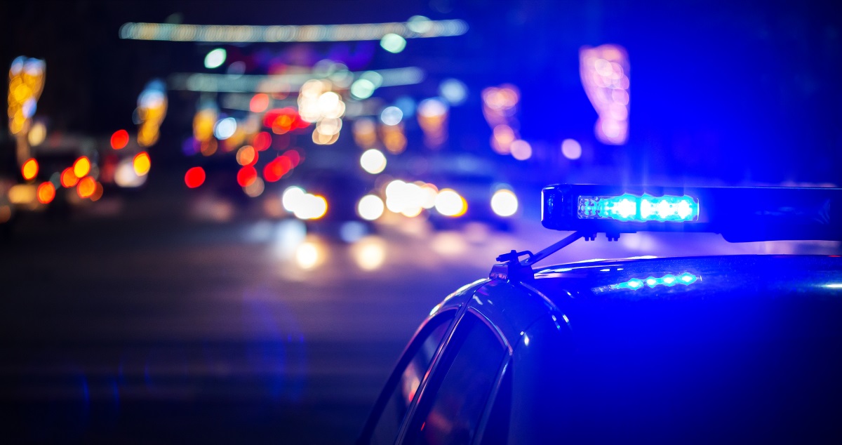 Image of night police car lights in city - close-up with selective focus and bokeh background blur